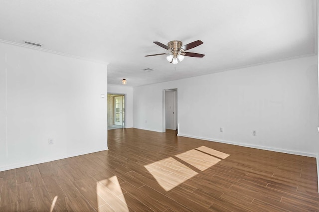unfurnished living room featuring baseboards, wood finished floors, ceiling fan, and crown molding