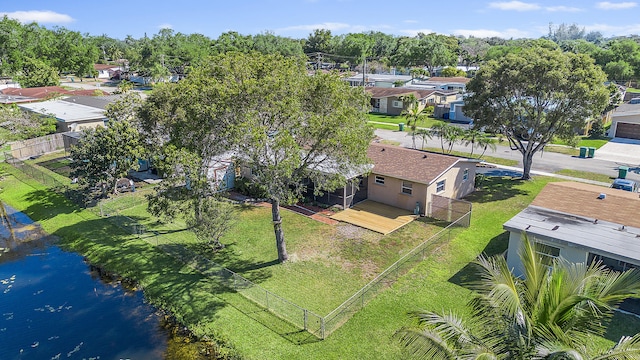 bird's eye view featuring a water view and a residential view