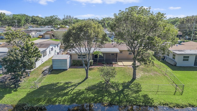 birds eye view of property with a residential view
