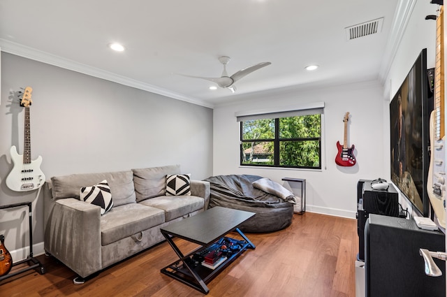 living room featuring recessed lighting, wood finished floors, and visible vents