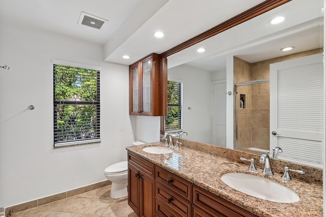 full bathroom with a healthy amount of sunlight, a sink, and visible vents