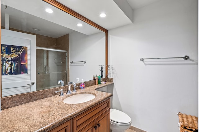 full bathroom featuring toilet, vanity, recessed lighting, and a stall shower