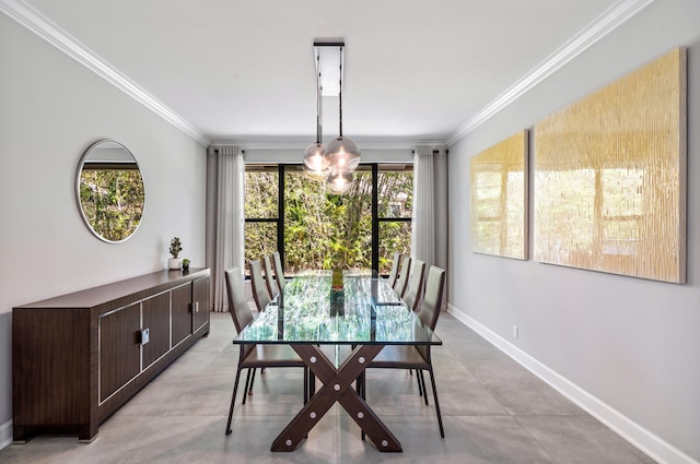 dining room featuring baseboards, concrete flooring, and ornamental molding