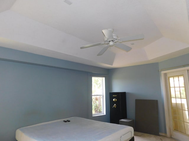 17609 72nd Rd N, The Acreage, FL 33470 - bedroom featuring a tray ceiling and a ceiling fan