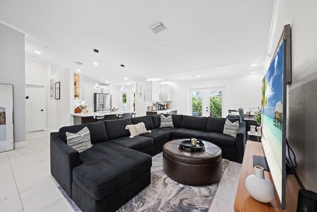 living area featuring french doors, recessed lighting, and visible vents