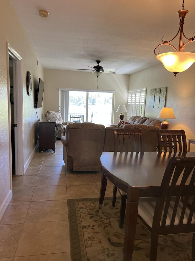 4220 Gator Trace Ave Unit 5E, Fort Pierce, FL 34982 - dining area featuring ceiling fan, baseboards, and light tile patterned flooring