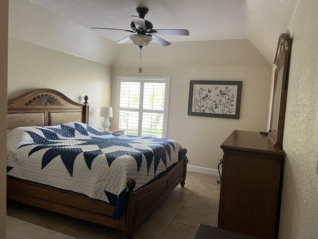 4220 Gator Trace Ave Unit 5E, Fort Pierce, FL 34982 - bedroom with vaulted ceiling, tile patterned floors, baseboards, and a ceiling fan