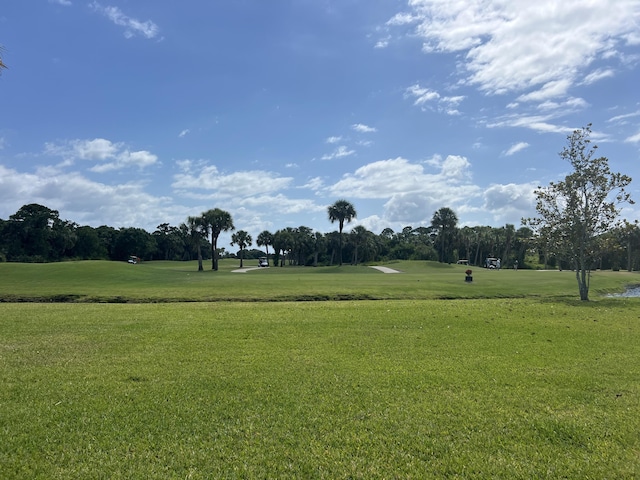4220 Gator Trace Ave Unit 5E, Fort Pierce, FL 34982 - view of property's community featuring golf course view and a lawn