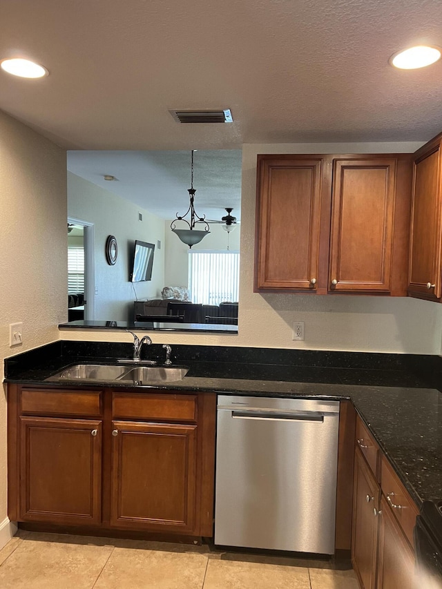 4220 Gator Trace Ave Unit 5E, Fort Pierce, FL 34982 - kitchen featuring dishwasher, brown cabinets, a sink, and visible vents