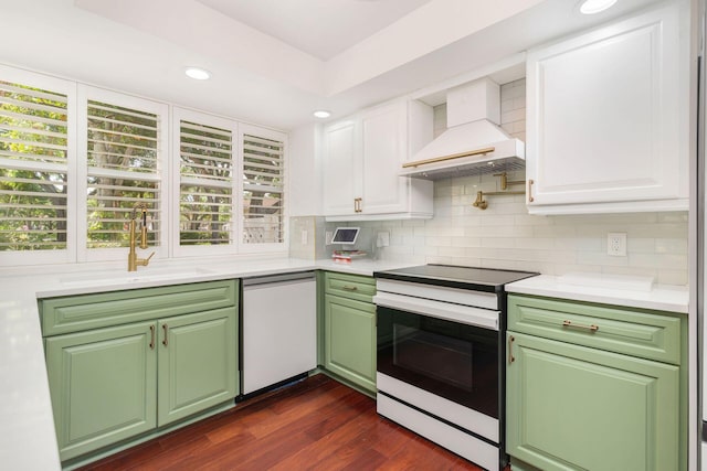 8110 Oakton Ct Unit 10B, Lake Clarke Shores, FL 33406 - kitchen with electric range, dishwasher, custom range hood, white cabinetry, and light countertops