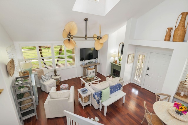 8110 Oakton Ct Unit 10B, Lake Clarke Shores, FL 33406 - living area featuring wood finished floors, lofted ceiling, a skylight, and a fireplace