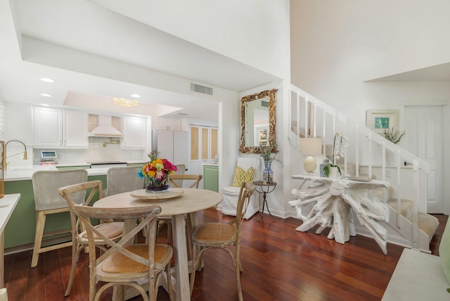 8110 Oakton Ct Unit 10B, Lake Clarke Shores, FL 33406 - dining area with stairway, dark wood-style flooring, a towering ceiling, and recessed lighting