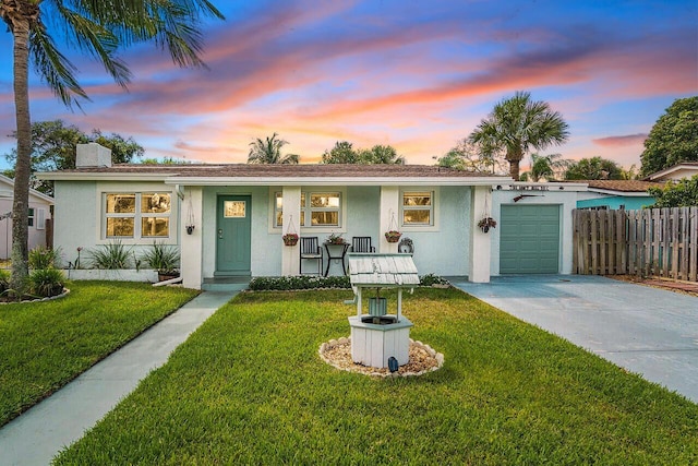 944 Hansen St, West Palm Beach, FL 33405 - ranch-style house with driveway, a garage, a chimney, and stucco siding