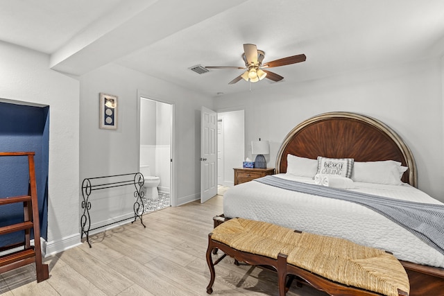 944 Hansen St, West Palm Beach, FL 33405 - bedroom with light wood-style flooring, baseboards, ensuite bathroom, and a ceiling fan