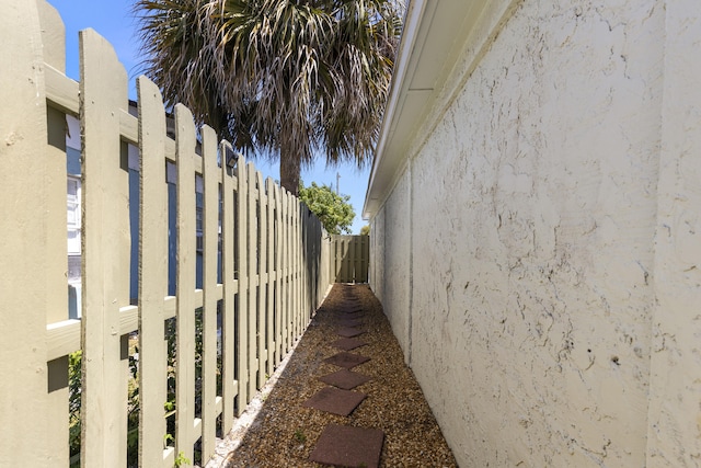 944 Hansen St, West Palm Beach, FL 33405 - view of side of property featuring stucco siding and fence