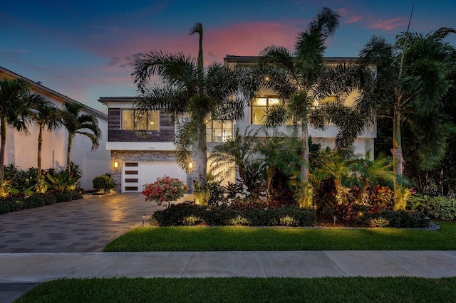 17045 Five Waters Ave, Boca Raton, FL 33496 - view of front of house with driveway, stucco siding, and an attached garage