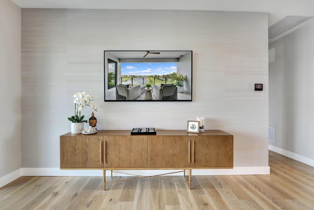 17045 Five Waters Ave, Boca Raton, FL 33496 - details with visible vents, baseboards, and wood finished floors