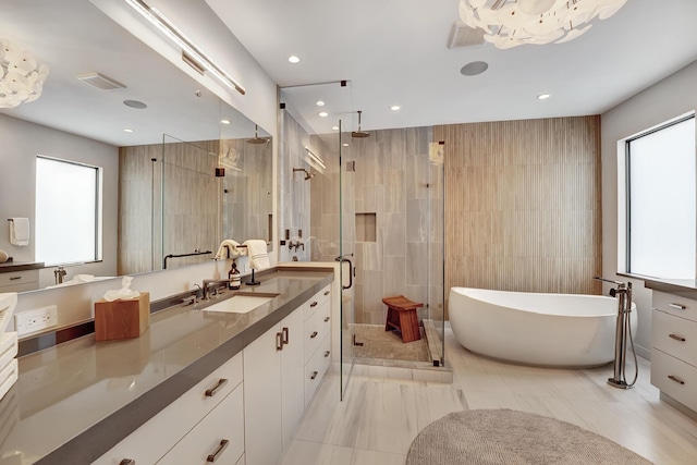 17045 Five Waters Ave, Boca Raton, FL 33496 - full bath featuring a shower stall, vanity, visible vents, and a wealth of natural light