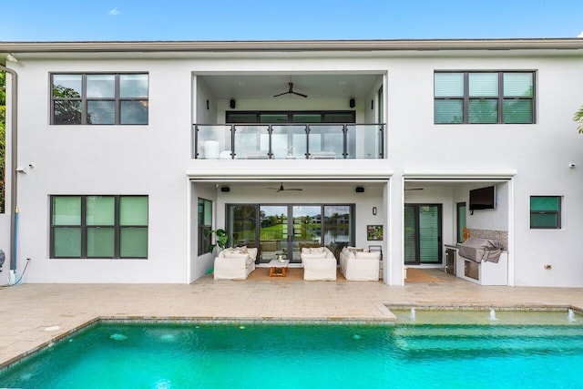 17045 Five Waters Ave, Boca Raton, FL 33496 - back of house featuring a patio area, stucco siding, a ceiling fan, and a balcony