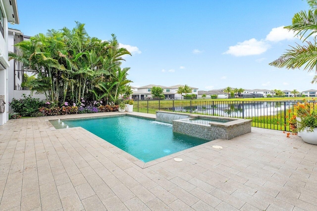 17045 Five Waters Ave, Boca Raton, FL 33496 - view of swimming pool with a pool with connected hot tub, a water view, a patio, fence, and a residential view