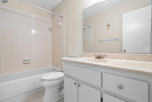 bathroom with tile patterned flooring, toilet, vanity, and tub / shower combination