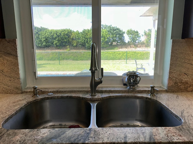 room details with stone counters and a sink