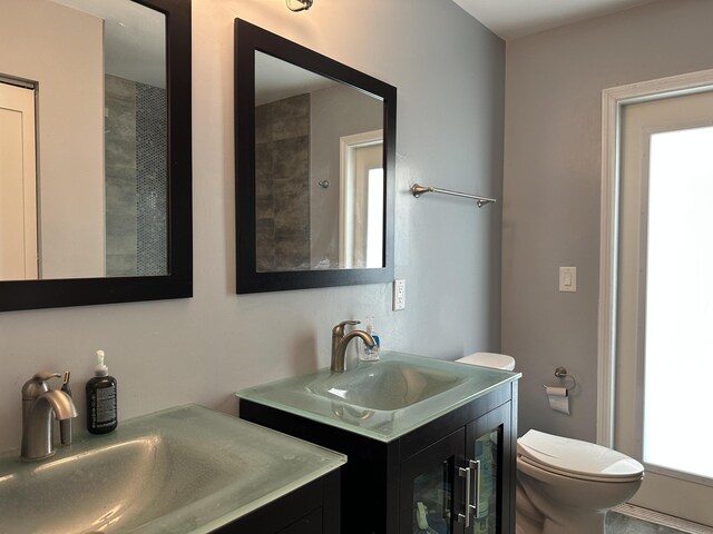 bathroom featuring toilet and vanity