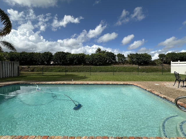 view of pool with a yard, a fenced in pool, and fence