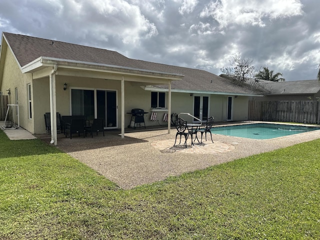 view of swimming pool featuring a yard, french doors, area for grilling, fence, and a patio