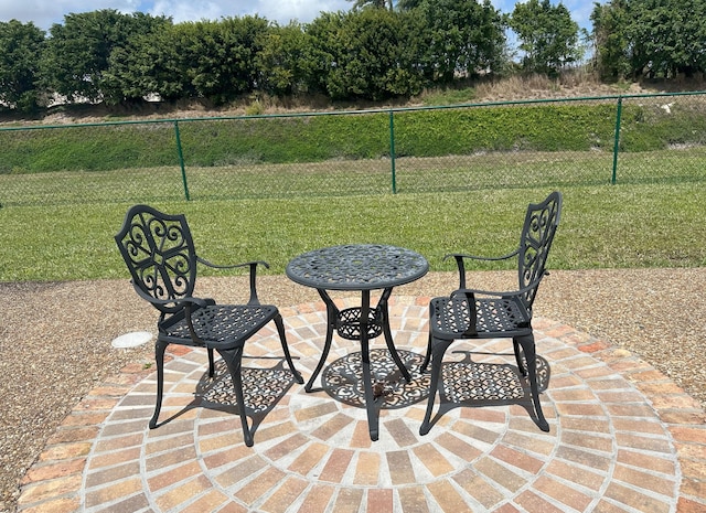 view of patio featuring fence