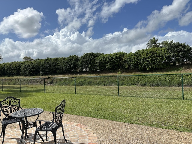 view of yard featuring a patio and fence