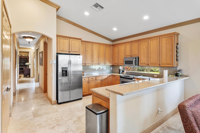 13434 Shell Beach Ct, Delray Beach, FL 33446 - kitchen with visible vents, arched walkways, tasteful backsplash, and stainless steel appliances