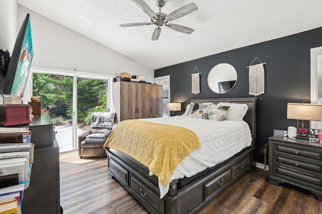 bedroom with access to outside, a textured ceiling, wood finished floors, and vaulted ceiling