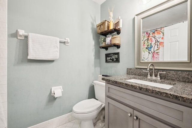 bathroom featuring tile patterned flooring, vanity, baseboards, toilet, and a shower with shower curtain