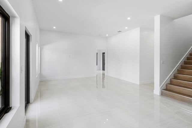 306 Plymouth Rd, West Palm Beach, FL 33405 - spare room featuring recessed lighting, visible vents, and stairway