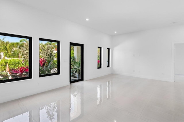 306 Plymouth Rd, West Palm Beach, FL 33405 - empty room with recessed lighting and light tile patterned floors