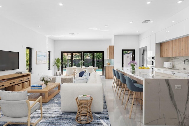 306 Plymouth Rd, West Palm Beach, FL 33405 - living room with visible vents, light wood-type flooring, recessed lighting, and a toaster