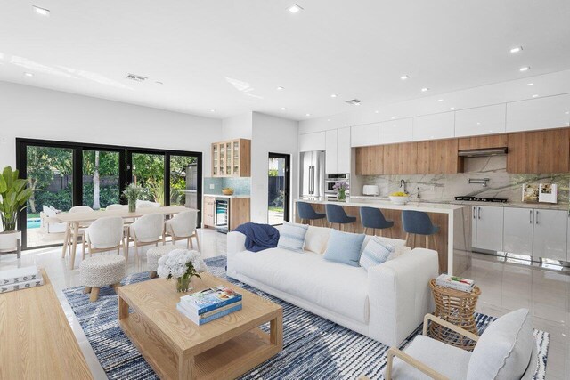 306 Plymouth Rd, West Palm Beach, FL 33405 - living room with recessed lighting, visible vents, and beverage cooler