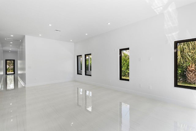 306 Plymouth Rd, West Palm Beach, FL 33405 - spare room featuring visible vents, baseboards, recessed lighting, and light tile patterned flooring