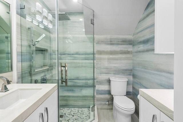 306 Plymouth Rd, West Palm Beach, FL 33405 - full bathroom with a stall shower, vanity, and tile walls