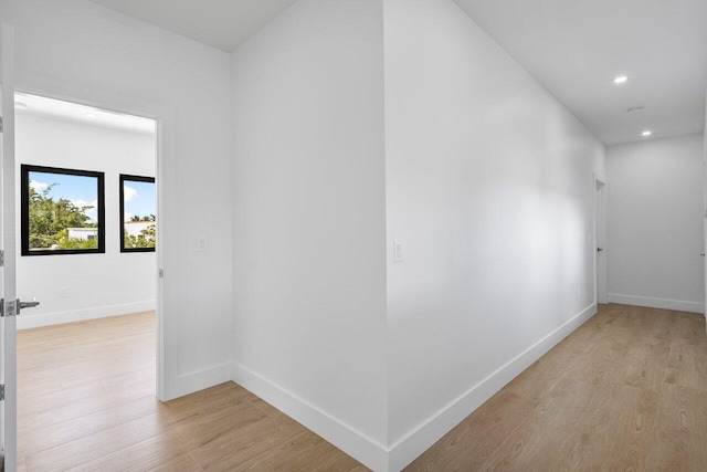 306 Plymouth Rd, West Palm Beach, FL 33405 - hall with light wood-type flooring, baseboards, and recessed lighting