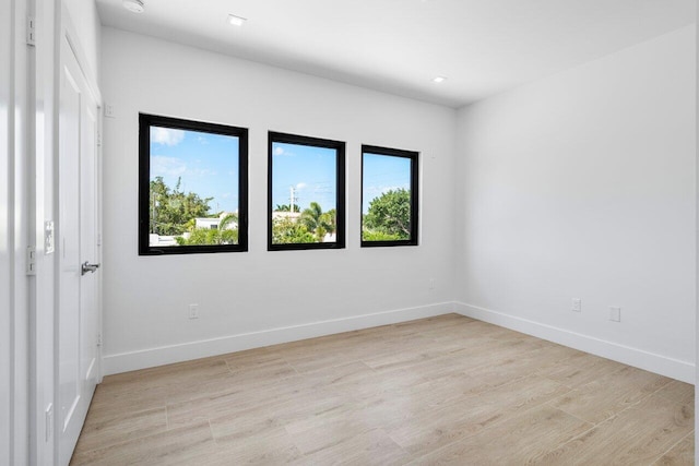 306 Plymouth Rd, West Palm Beach, FL 33405 - unfurnished room featuring baseboards, recessed lighting, and light wood-style floors