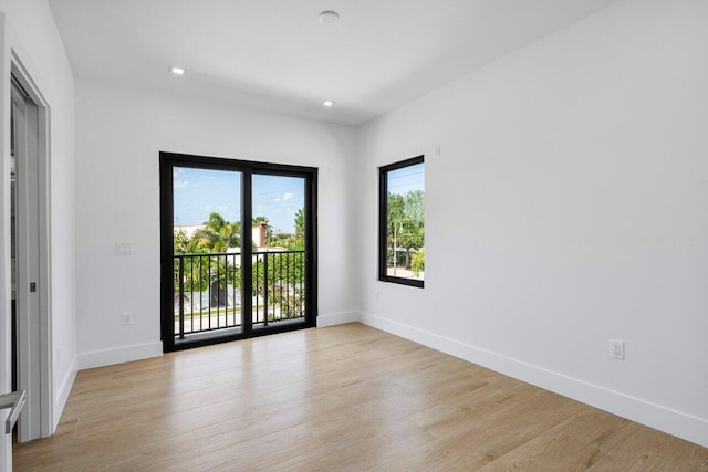 306 Plymouth Rd, West Palm Beach, FL 33405 - empty room featuring recessed lighting, light wood-type flooring, and baseboards