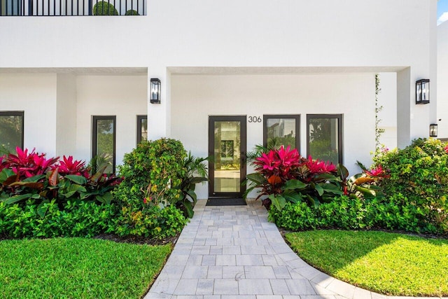306 Plymouth Rd, West Palm Beach, FL 33405 - view of exterior entry featuring stucco siding