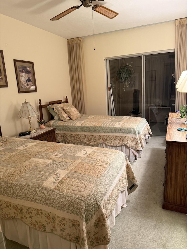 bedroom with ceiling fan and carpet