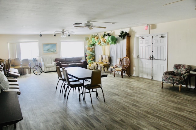 dining area with ceiling fan and wood finished floors