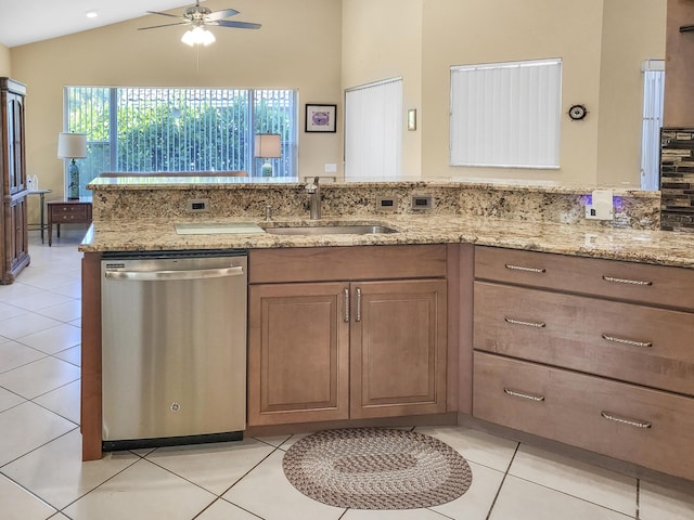 12404 Lakeridge Falls Dr, Boynton Beach, FL 33437 - kitchen with dishwasher, light tile patterned floors, a sink, light stone countertops, and ceiling fan