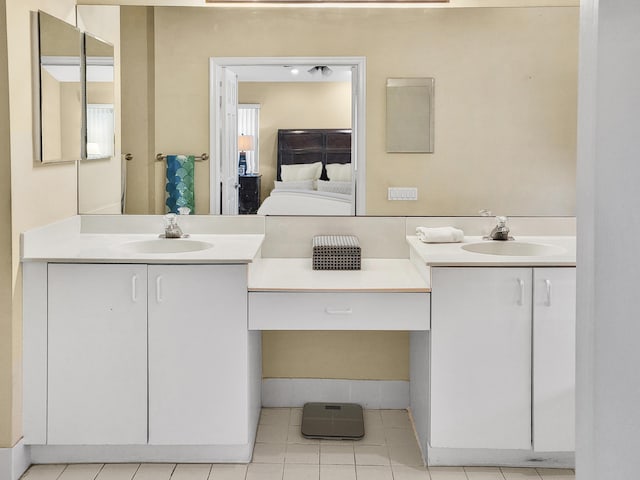 12404 Lakeridge Falls Dr, Boynton Beach, FL 33437 - bathroom with two vanities, tile patterned floors, and a sink
