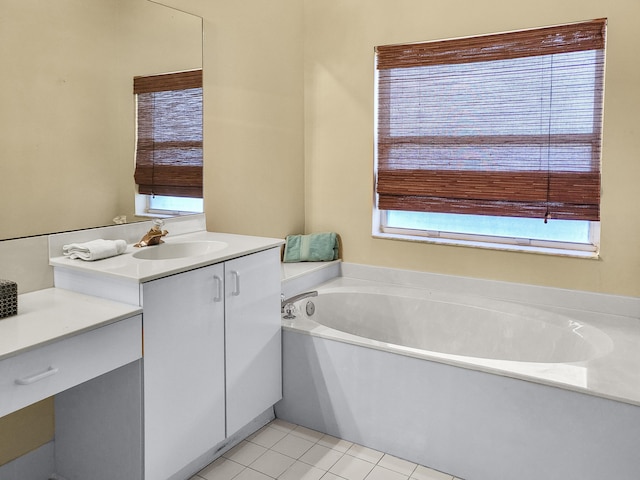 12404 Lakeridge Falls Dr, Boynton Beach, FL 33437 - bathroom with tile patterned flooring, a garden tub, and vanity