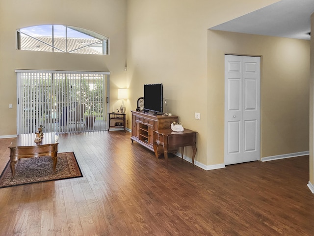 12404 Lakeridge Falls Dr, Boynton Beach, FL 33437 - living room with hardwood / wood-style flooring, baseboards, and a towering ceiling